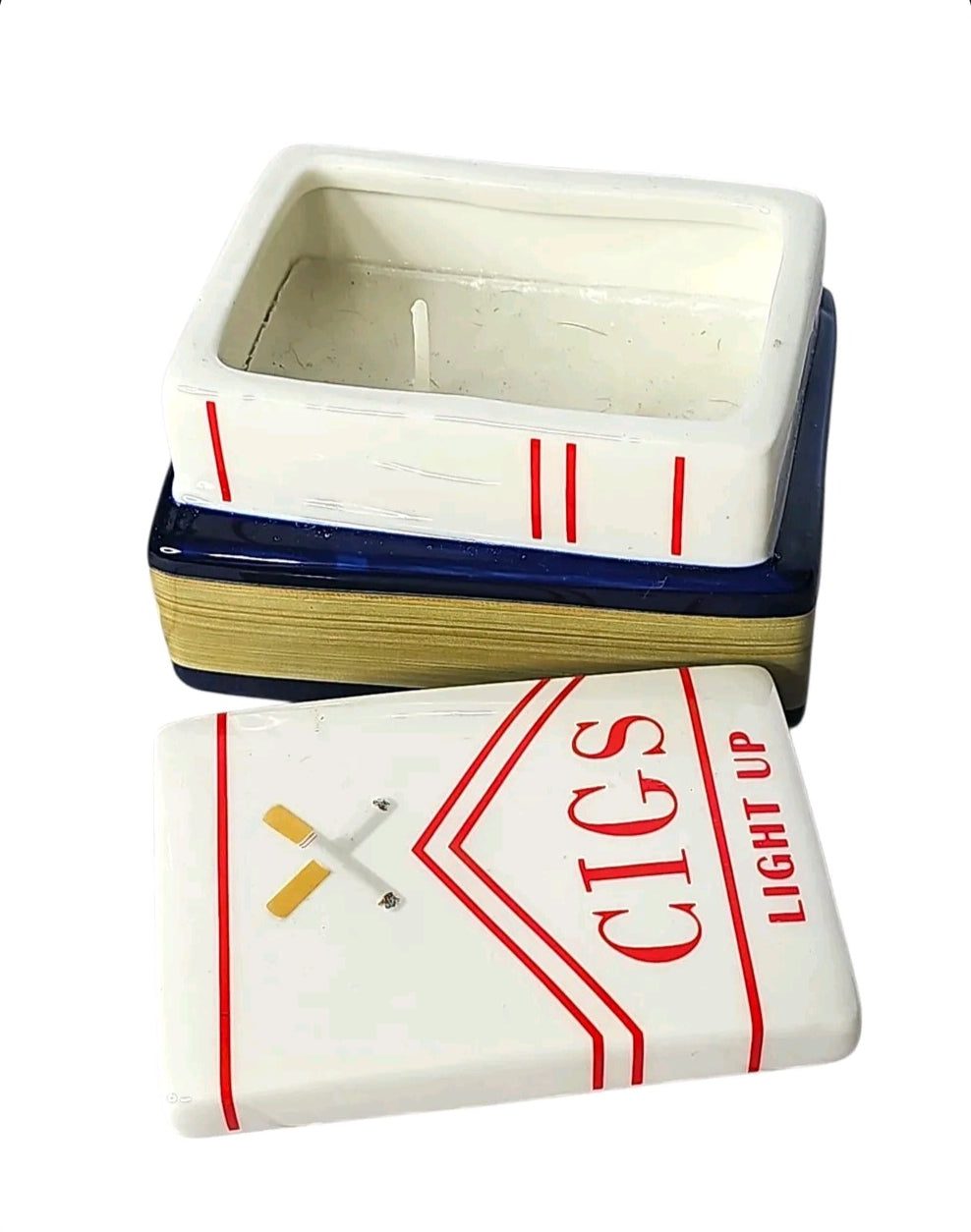 Oddly Darling Vintage ceramic trinket box and candle holder shaped like a vintage cigarette pack on a book base.