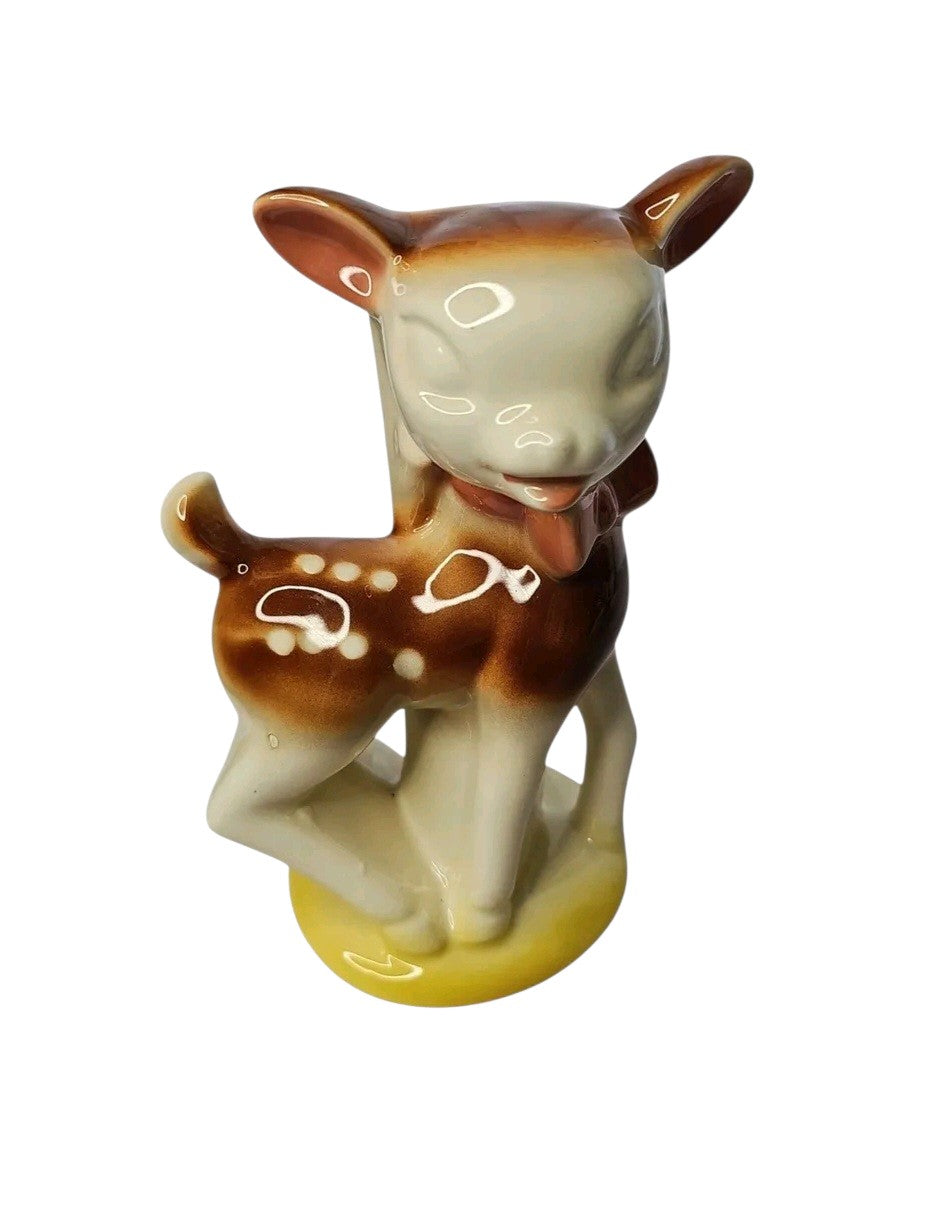 Oddly Darling Vintage ceramic fawn figurine planter in cream and brown with a yellow base and dainty bow detail