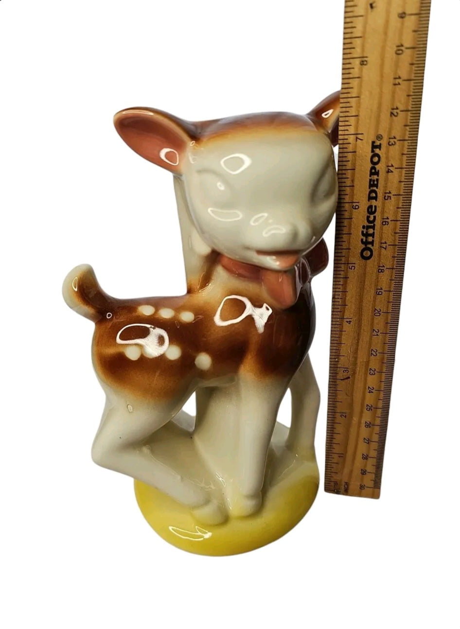 Oddly Darling Vintage ceramic fawn figurine planter with glossy cream and brown finish and a yellow base.