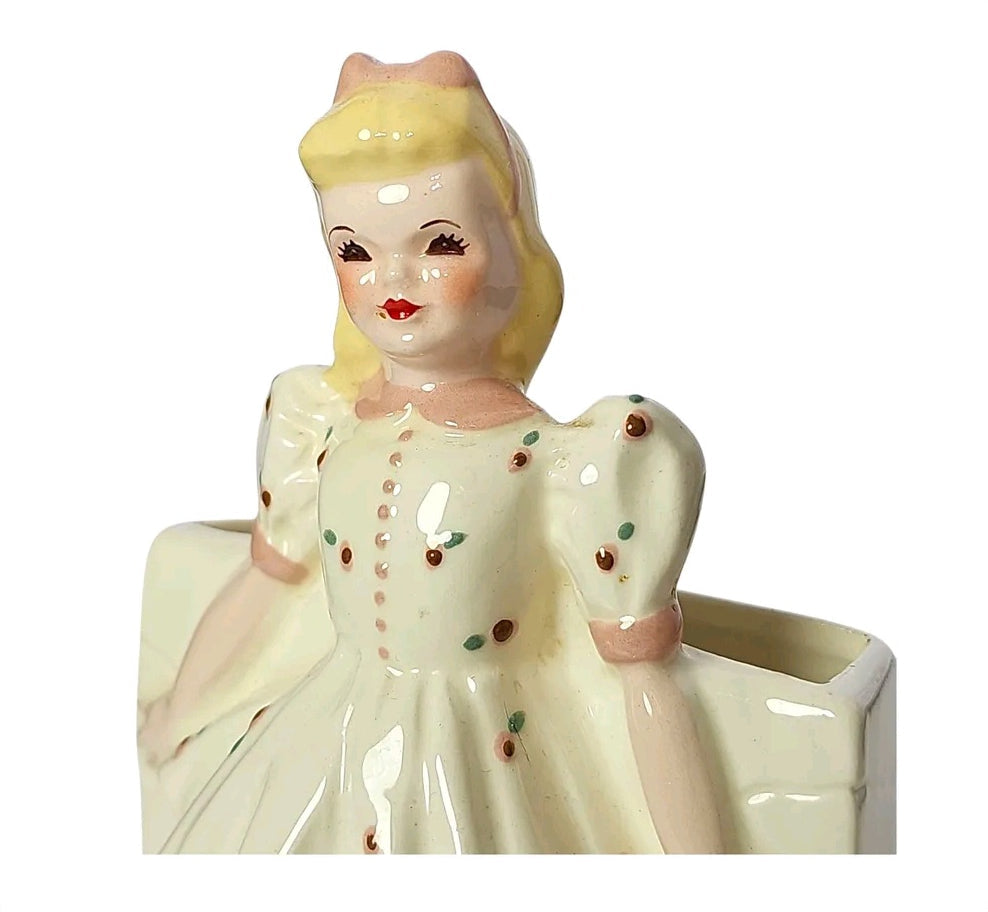Vintage ceramic girl planter in cream tiered dress with rosebud print