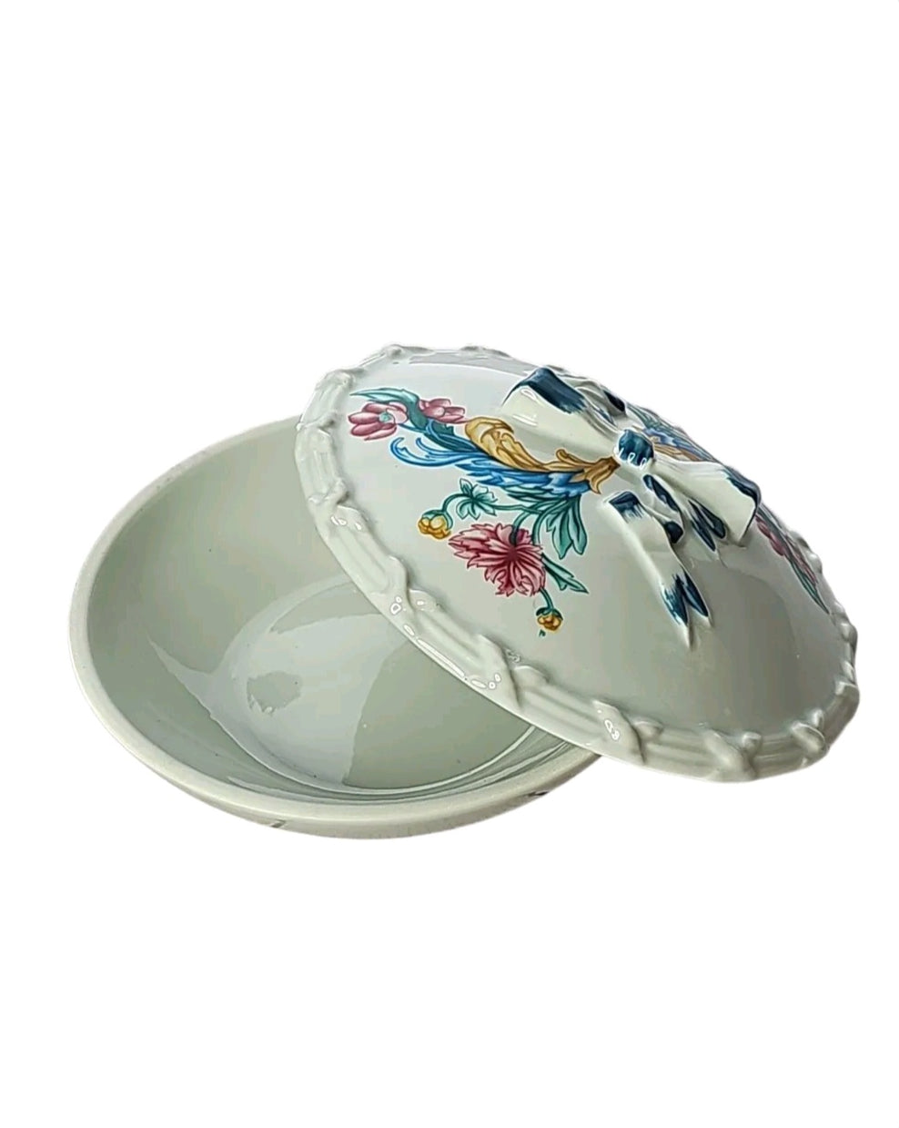 Oddly Darling Vintage ceramic lidded dish with cream glaze, floral motifs, and a sculpted ribbon bow on the lid.