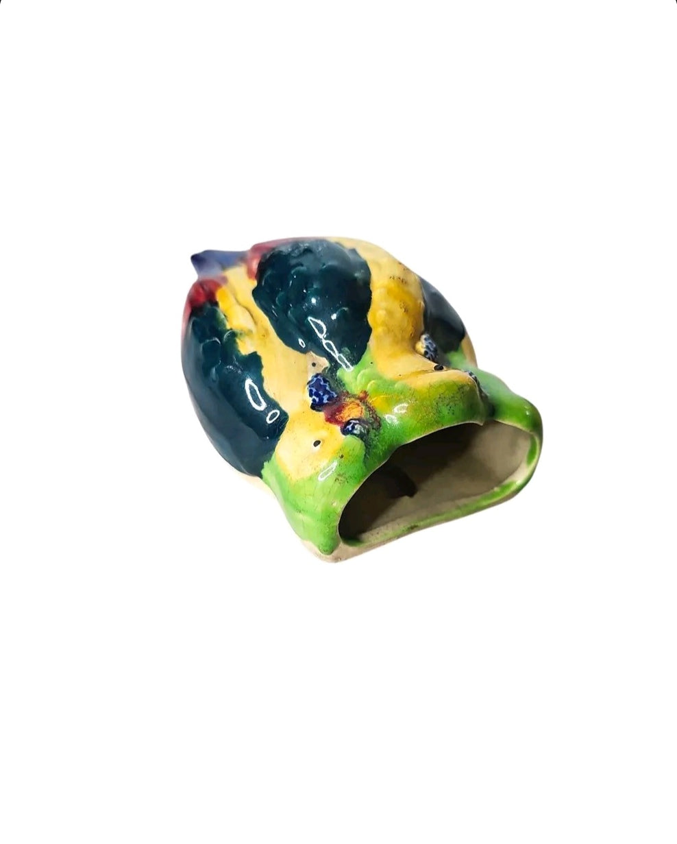 Oddly Darling Vintage ceramic parrot wall pocket planter with a glossy, multi-colored finish in yellow, green, and blue.