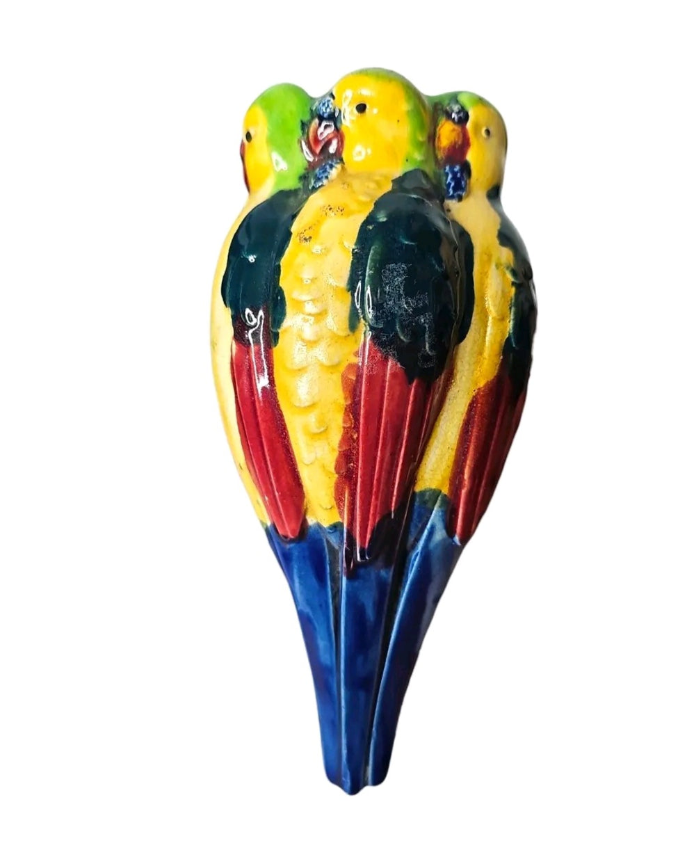Oddly Darling Vintage ceramic parrot wall pocket planter with a glossy finish in vibrant yellow, green, red, and blue.
