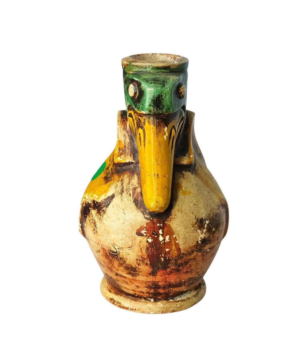 Oddly Darling Vintage ceramic pelican pitcher with hand-painted green, yellow, and rustic weathered earth tones.