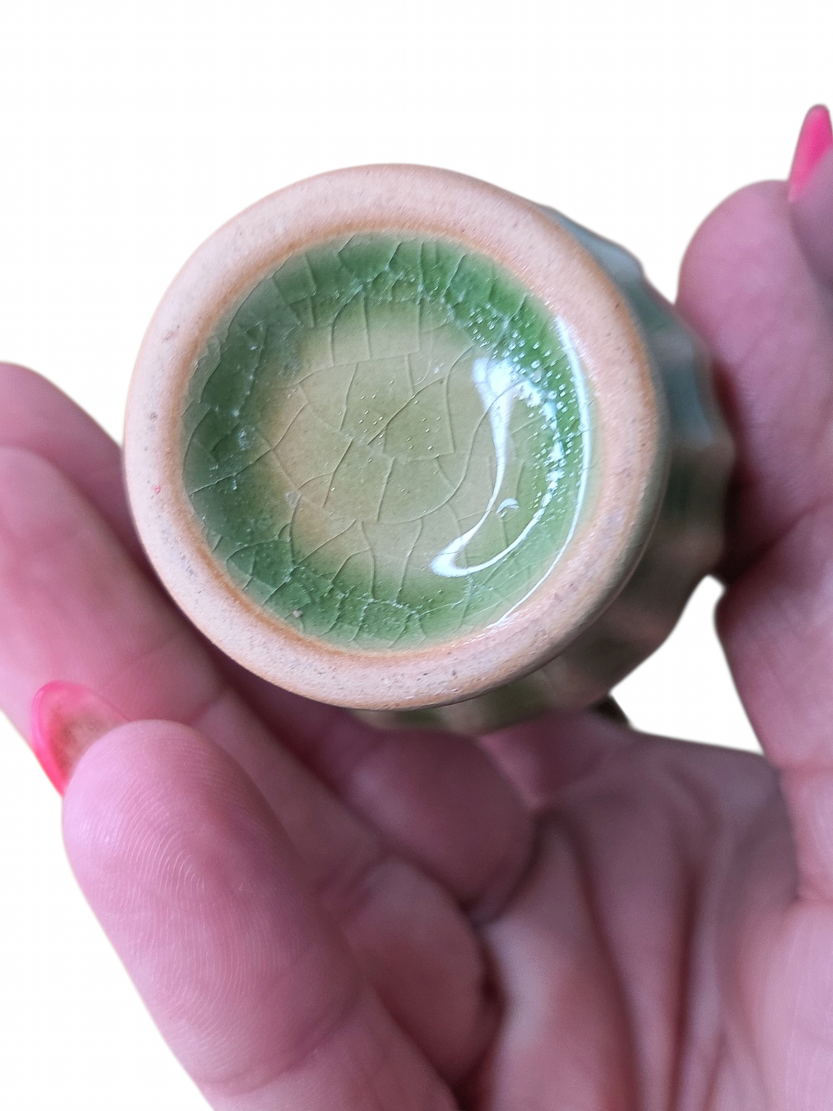 Oddly Darling Vintage ceramic pitcher base showing sage green crackle glaze and ribbed texture held in a hand