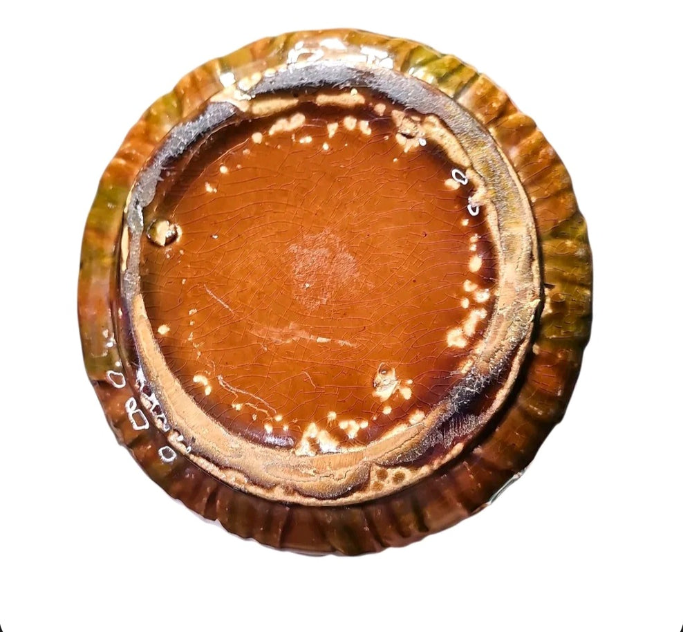Bottom view of majolica style pitcher showing the base