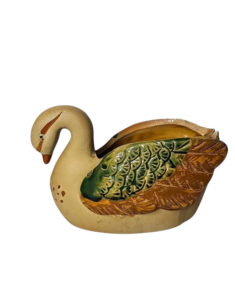 Oddly Darling Vintage ceramic swan planter with hand-painted green and brown wing details on a neutral base.