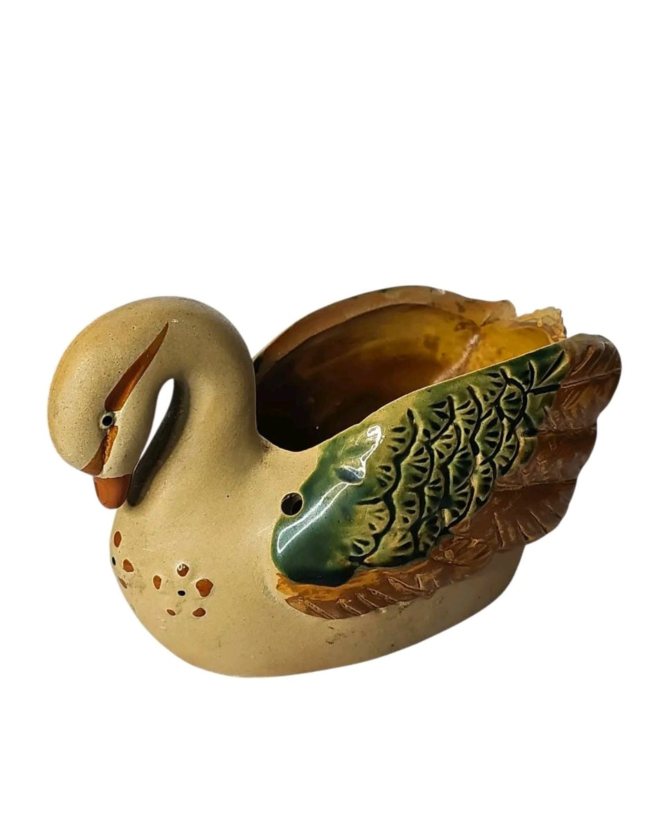 Oddly Darling Vintage ceramic swan planter with hand-painted green and brown wing details on a neutral earthy base.