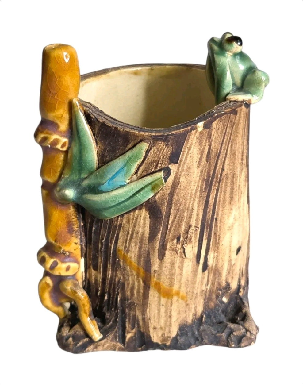 Oddly Darling Vintage handcrafted ceramic tree stump vessel with a green frog and bamboo accent for desk organization.