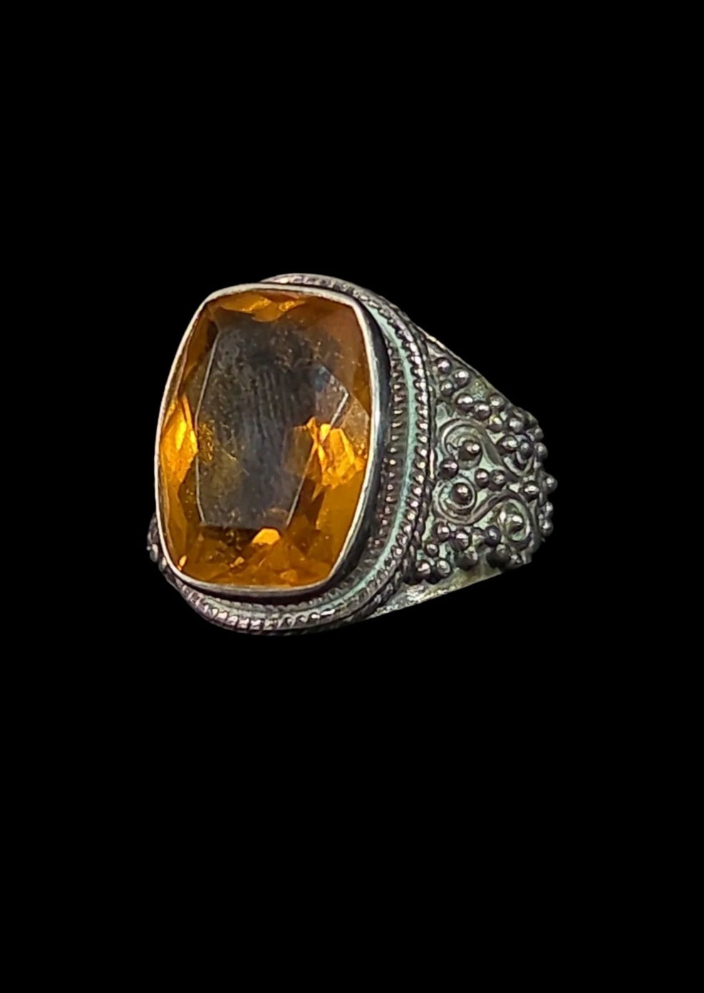 Oddly Darling Vintage statement ring featuring a large cushion-cut citrine in an ornate sterling silver band.