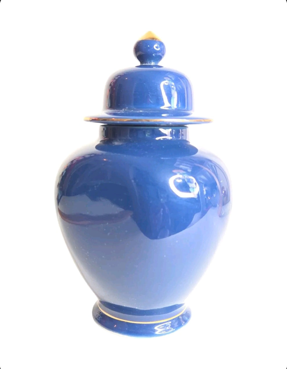 Oddly Darling Vintage cobalt blue porcelain ginger jar with a matching lid and gold-toned finial on a white background