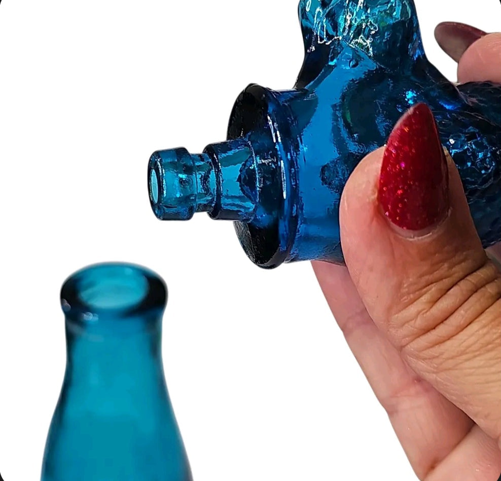 Oddly Darling Vintage cobalt blue glass poodle decanter bottle with textured stopper held in hand