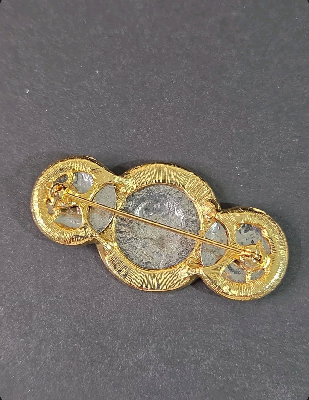 Back view of Oddly Darling Vintage coin brooch featuring a gold-tone setting with a secure pin closure.