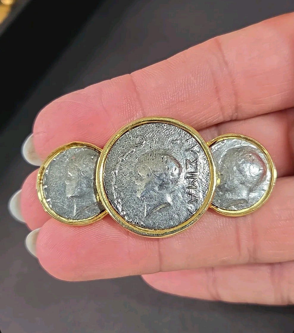 Oddly Darling Vintage statement brooch featuring three antique silver coin medallions in polished gold-tone settings.