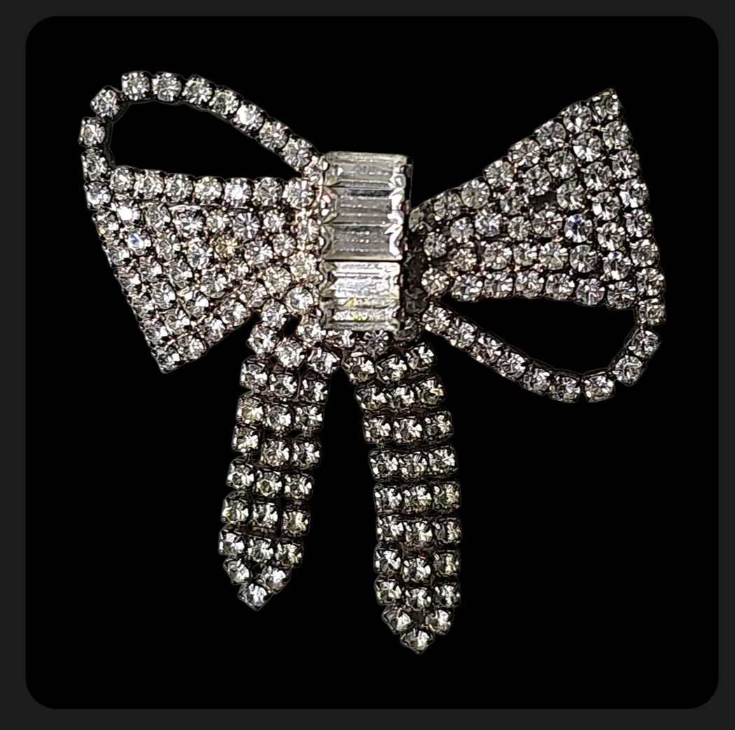 Oddly Darling Vintage crystal bow brooch featuring pave-set rhinestones and a baguette-cut crystal center.