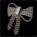 Oddly Darling Vintage crystal bow brooch with shimmering pave rhinestones and baguette-cut center detail