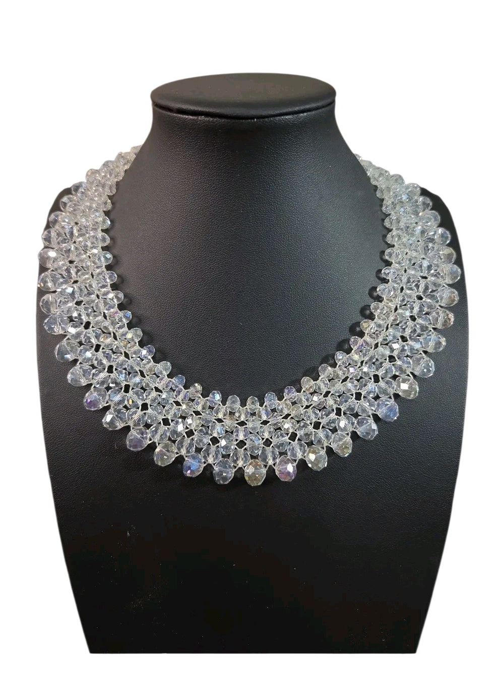 Oddly Darling Vintage handcrafted crystal statement collar necklace with multi-layered faceted clear beads on a display