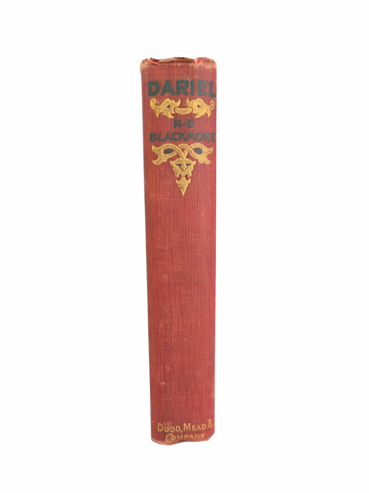 Oddly Darling Vintage antique red cloth-bound book spine with ornate gold-embossed lettering and Victorian motifs.