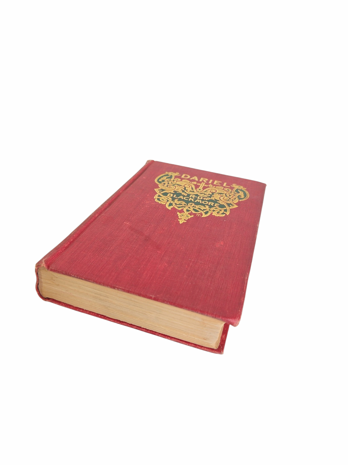 Oddly Darling Vintage 1897 Dariel hardcover book with red cloth cover and ornate gold-embossed Victorian detailing.