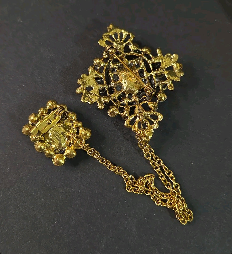 Oddly Darling Vintage ornate double brooch set with gold-tone chain, showing the back view with secure pin closures.