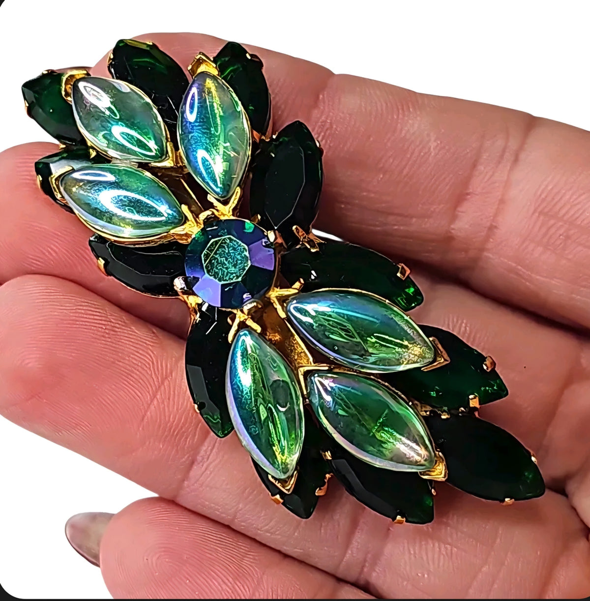 Oddly Darling Vintage brooch featuring emerald green marquise stones and iridescent accents in a gold-tone setting.