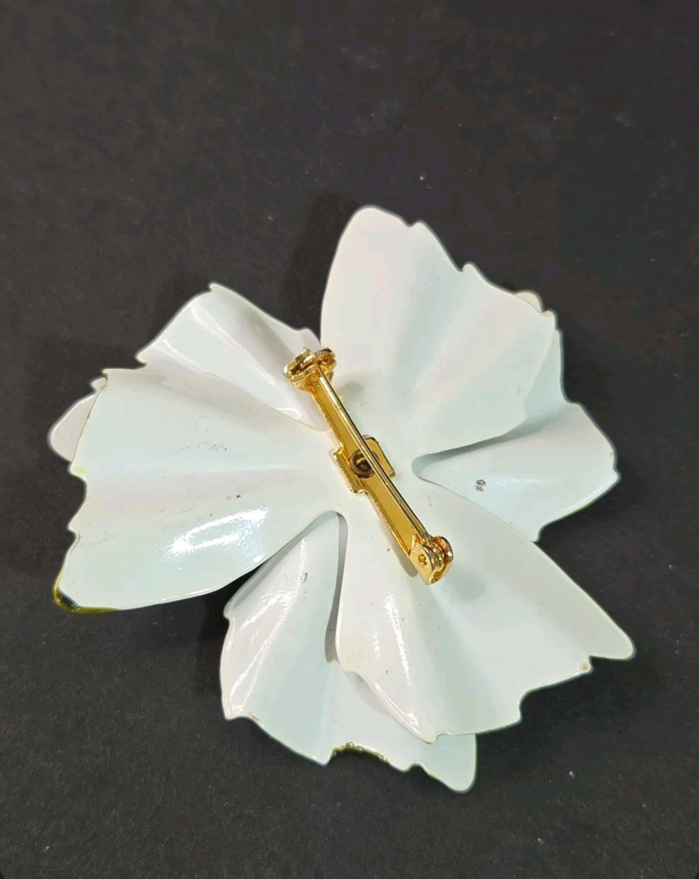 Oddly Darling Vintage enamel flower brooch back view showing the secure gold-tone pin closure on white petals.
