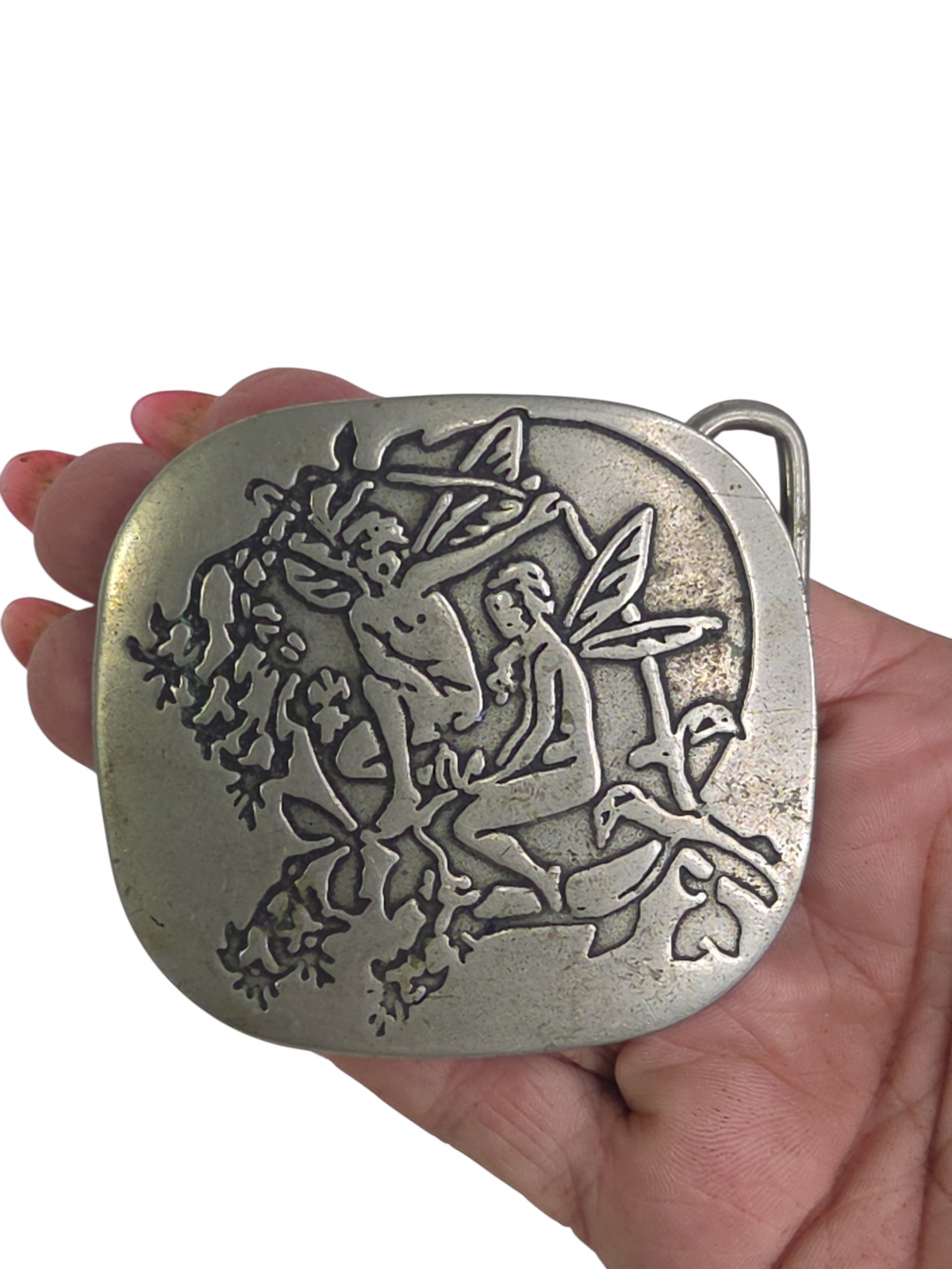 Oddly Darling Vintage silver-toned belt buckle featuring an embossed fairy and foliage design in a rustic style.