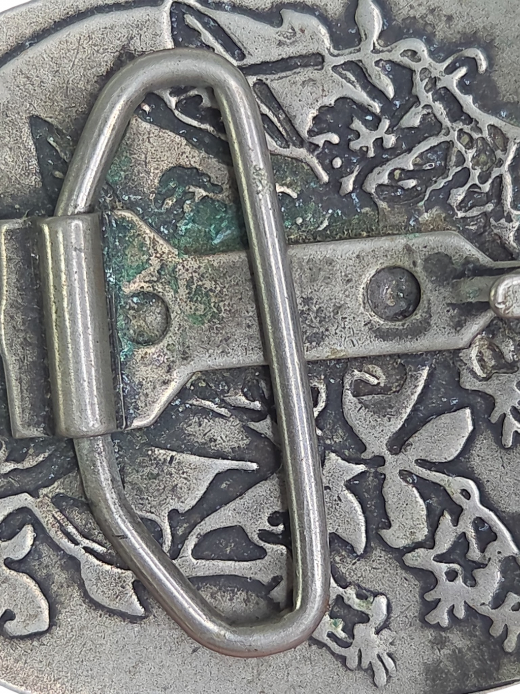 Oddly Darling Vintage silver-toned belt buckle featuring an embossed fairy and foliage design with a weathered finish.