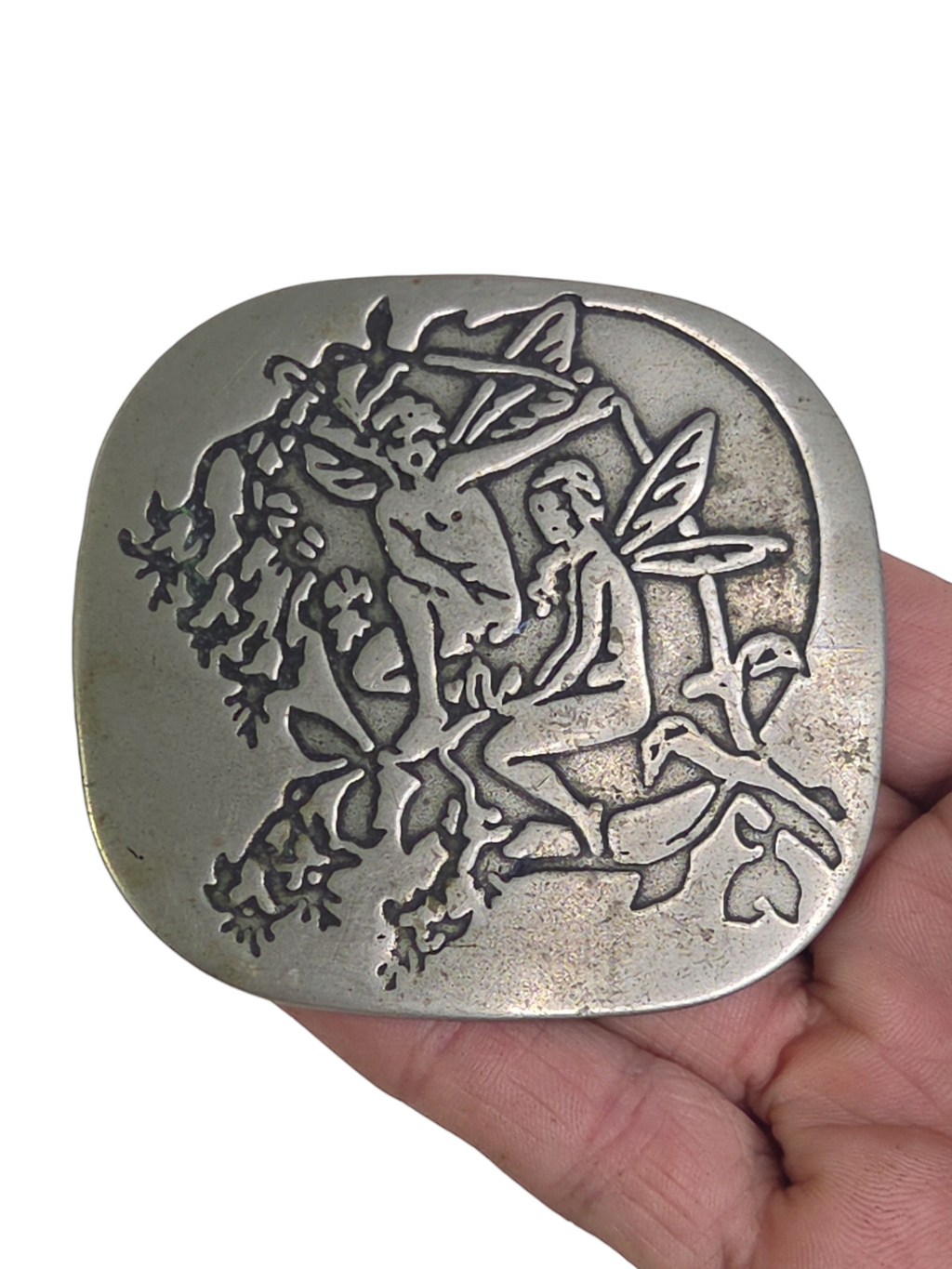 Oddly Darling Vintage silver-toned belt buckle featuring an embossed fairy and foliage design in a weathered finish.
