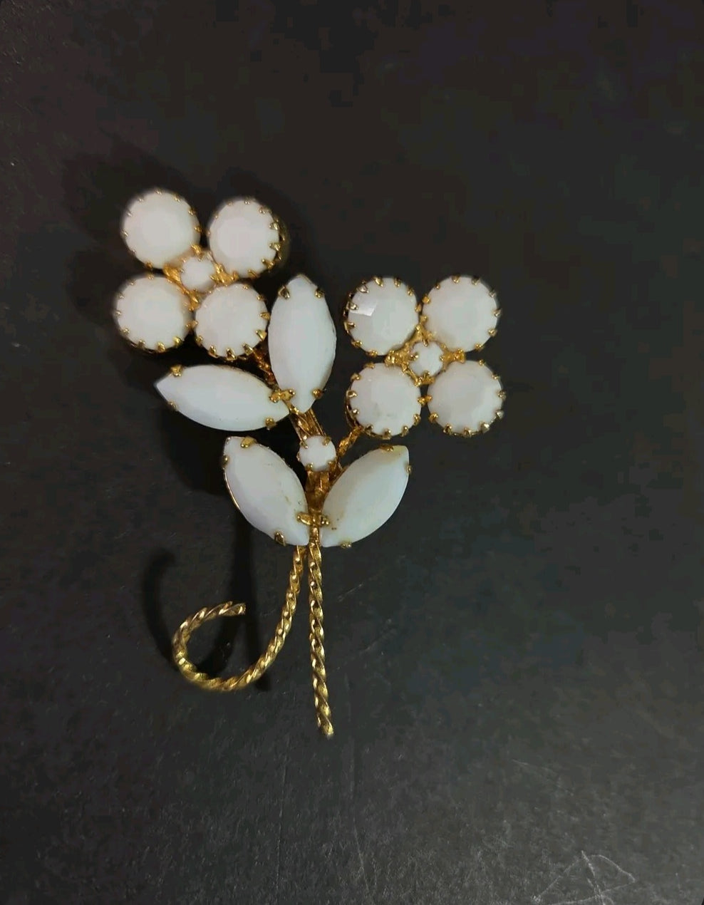 Oddly Darling Vintage floral brooch with white cabochon flower clusters and gold-tone marquise leaf accents.