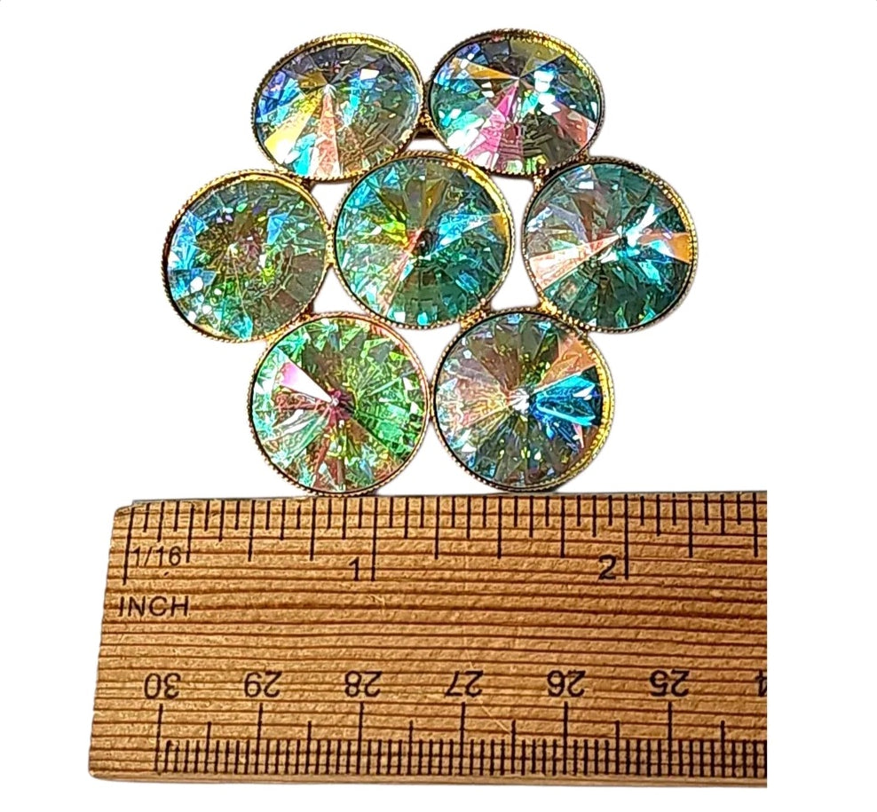 Oddly Darling Vintage floral cluster brooch with iridescent teal and gold crystals in a gold-tone metal setting.