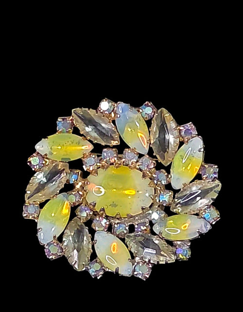 Oddly Darling Vintage floral brooch with a central oval cabochon, marquise-cut iridescent stones, and gold-tone base.