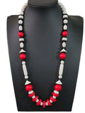 Oddly Darling Vintage geometric statement necklace featuring red, white, and black beads in sphere and disc shapes.