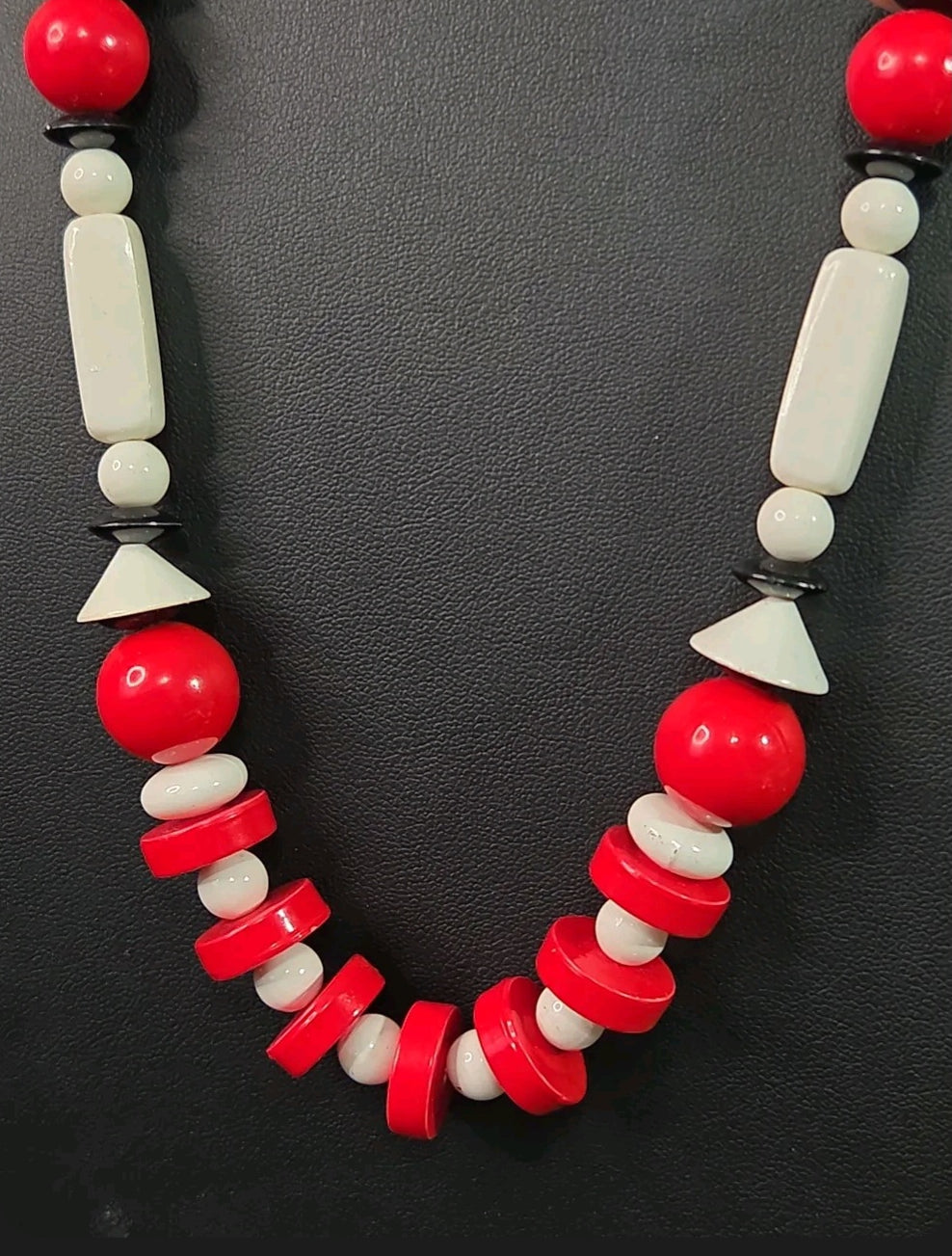 Oddly Darling Vintage geometric statement necklace featuring red, white, and black beads in sphere and disc shapes.