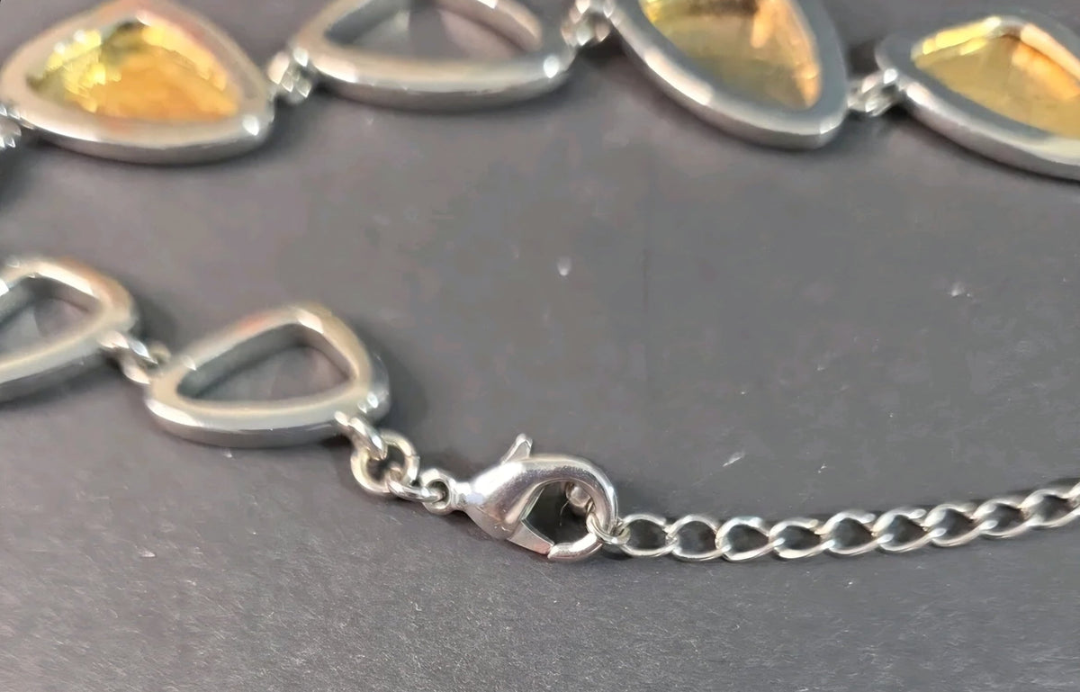 Oddly Darling Vintage mixed-metal statement necklace featuring silver-tone geometric links with gold-tone accents.