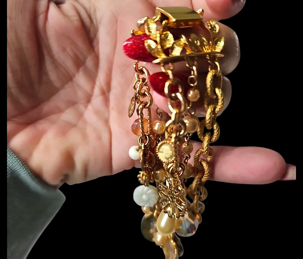 Oddly Darling Vintage multi-strand gold-tone charm bracelet with faux pearls, floral charms, and a central cabochon.