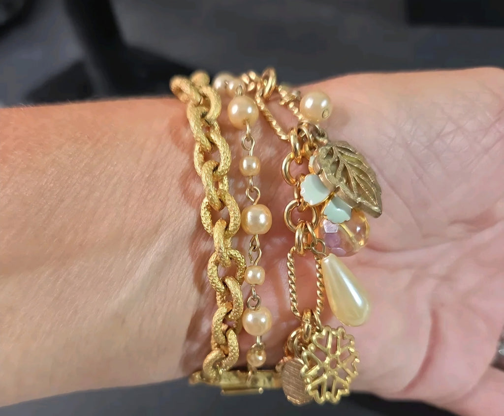 Oddly Darling Vintage multi-strand gold-tone bracelet featuring faux pearls, textured chains, and leaf charms.