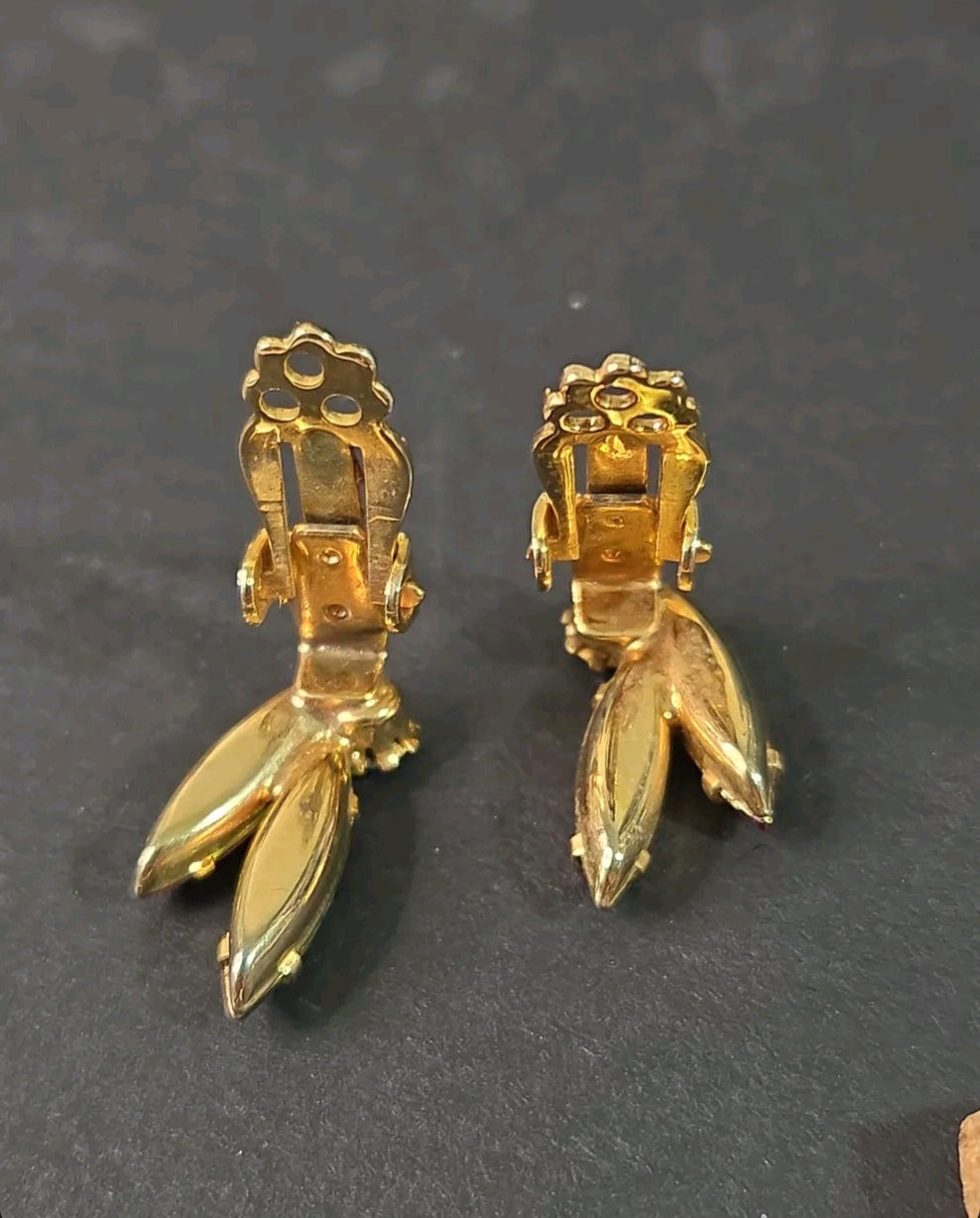 Oddly Darling Vintage gold-tone clip-on earrings showing the sturdy back mechanism and leaf-shaped crystal settings.
