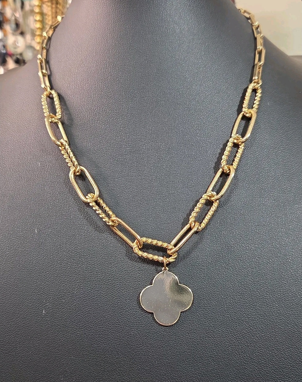Oddly Darling Vintage gold-tone necklace featuring a polished clover charm on a textured mixed-link chain.