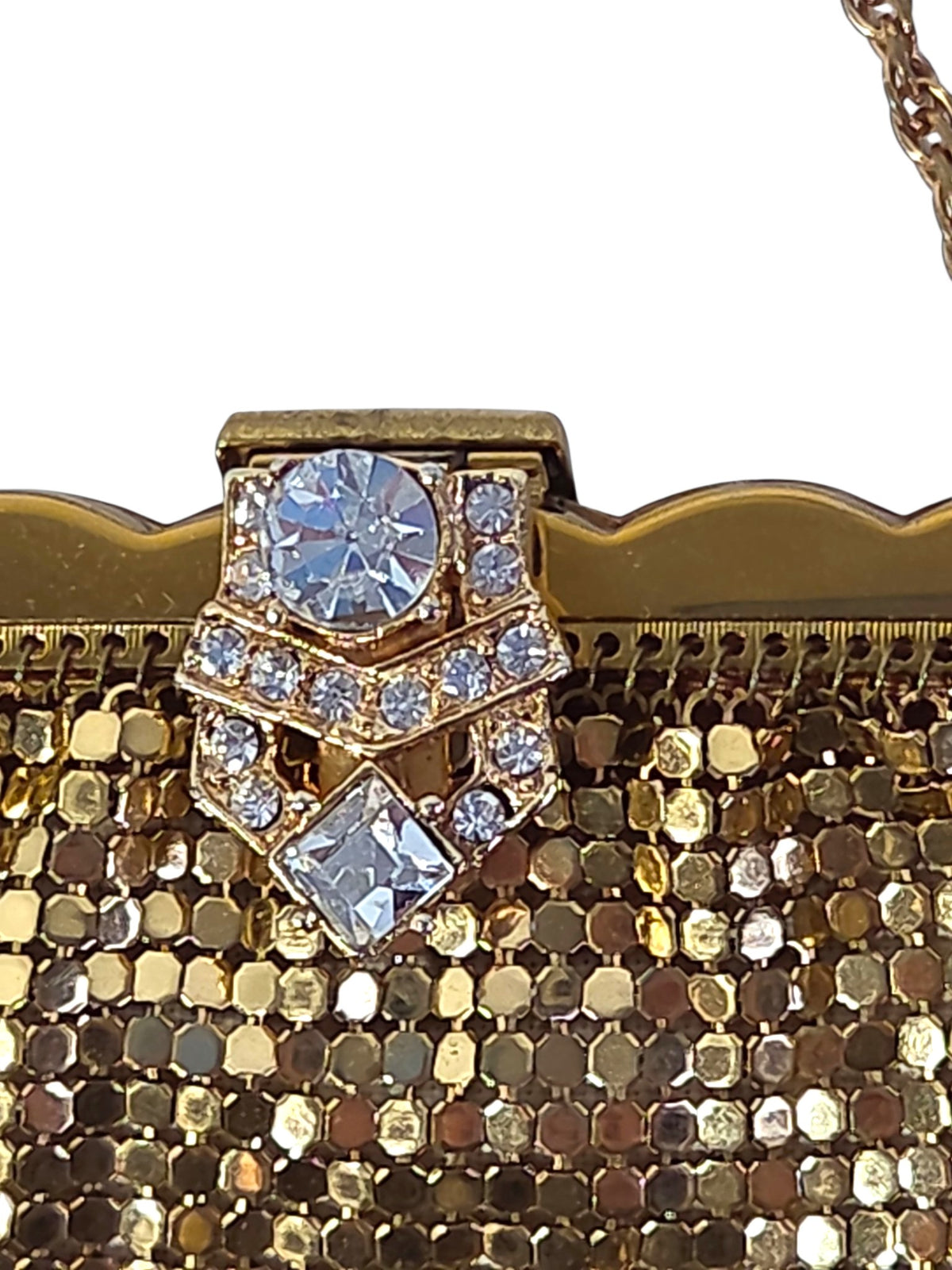 Close-up of the Art Deco style clasp with a large round rhinestone, a square-cut stone and a chevron of small clear stones