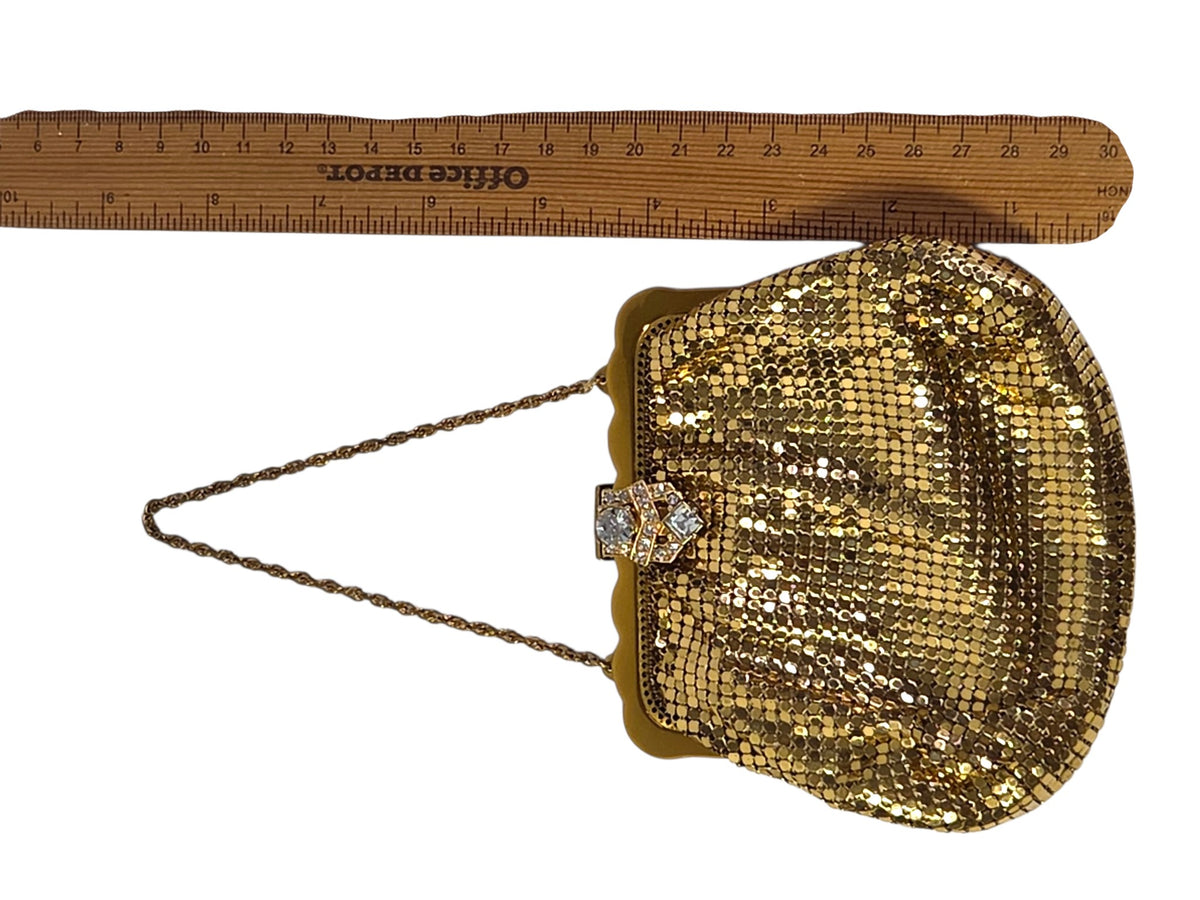 Whiting & Davis gold mesh evening bag laid beside a ruler, 5 1/4 inches wide