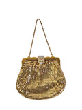 Whiting & Davis gold mesh evening bag on white with an Art Deco style rhinestone clasp, scalloped gold-tone frame and rope chain handle