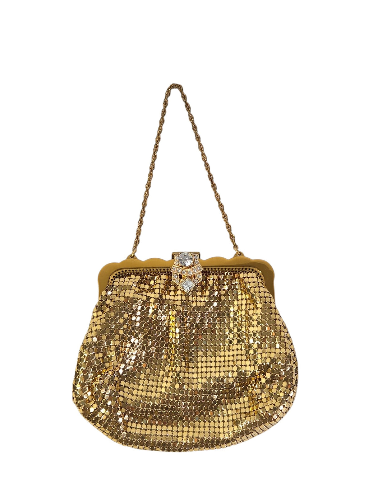 Whiting & Davis gold mesh evening bag on white with an Art Deco style rhinestone clasp, scalloped gold-tone frame and rope chain handle