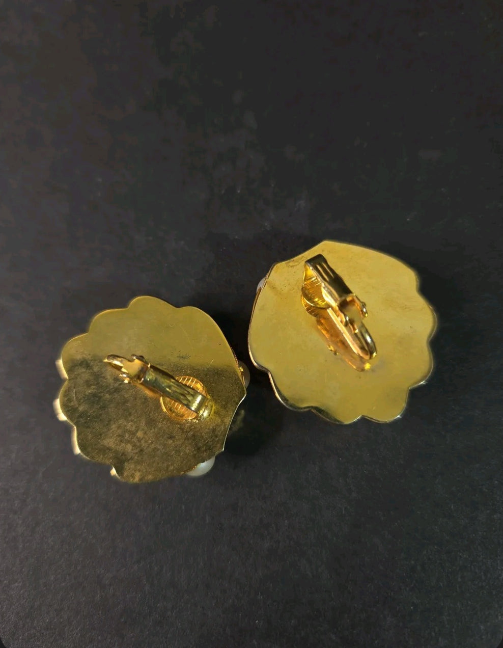 Oddly Darling Vintage gold-tone shell clip-on earrings with secure backings shown from the reverse side