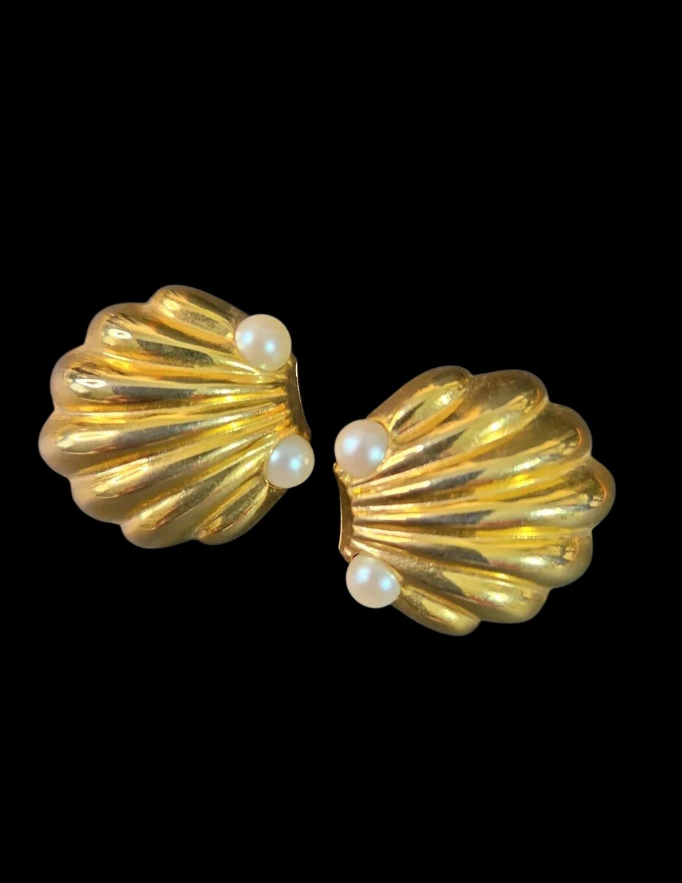Oddly Darling Vintage gold-tone scalloped shell clip-on earrings with faux pearl accents on a black background