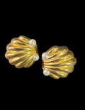 Oddly Darling Vintage gold-tone scalloped shell clip-on earrings with faux pearl accents on a black background