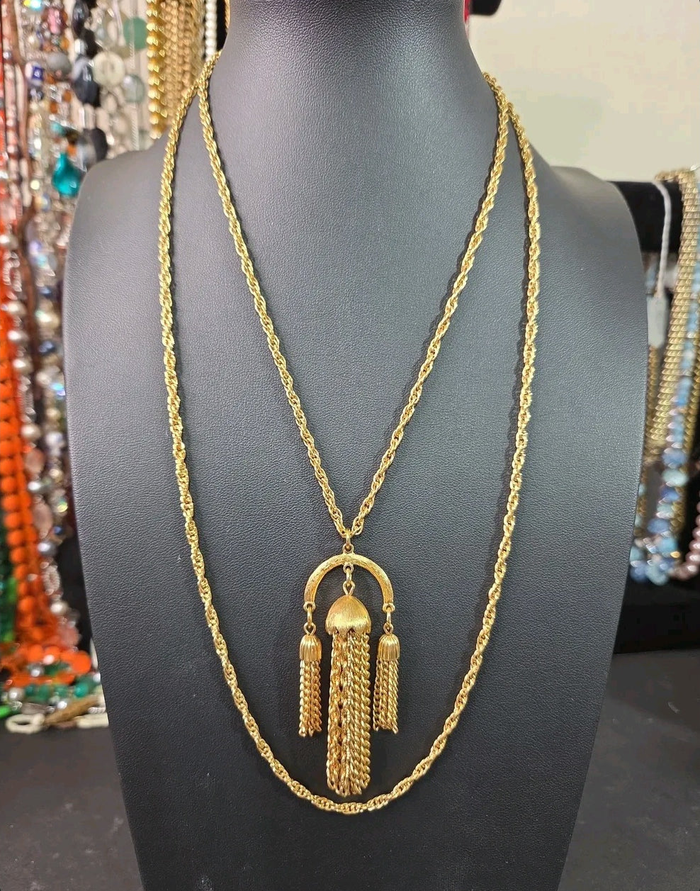 Oddly Darling Vintage gold-tone statement necklace featuring an arch pendant with cascading chain tassels on a rope chain