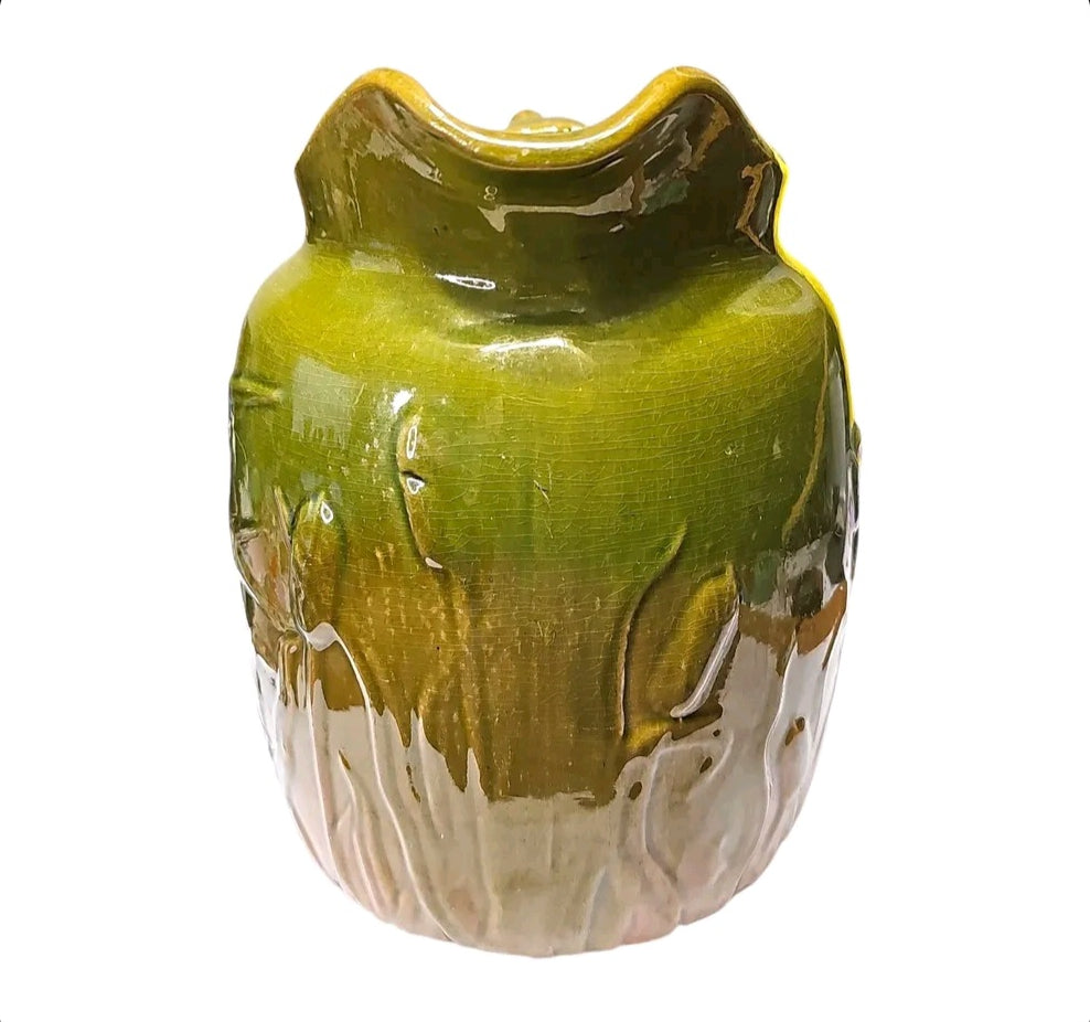 Majolica style pitcher with raised bird and reed design