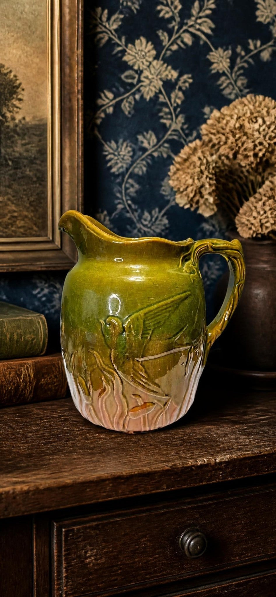 Majolica style bird and cattail pitcher styled photo