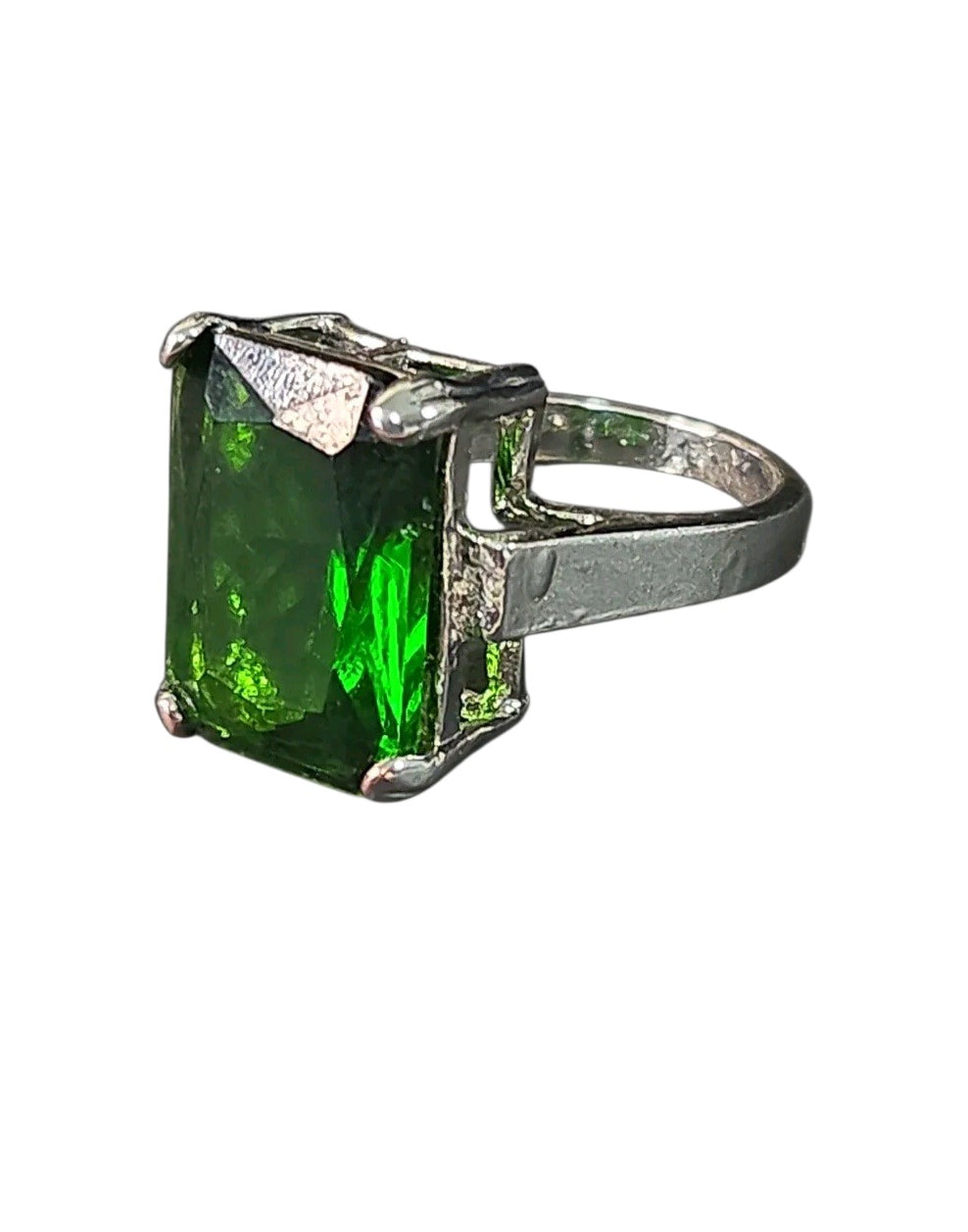 Oddly Darling Vintage statement ring featuring a large emerald-cut green gemstone in a polished silver-tone setting.